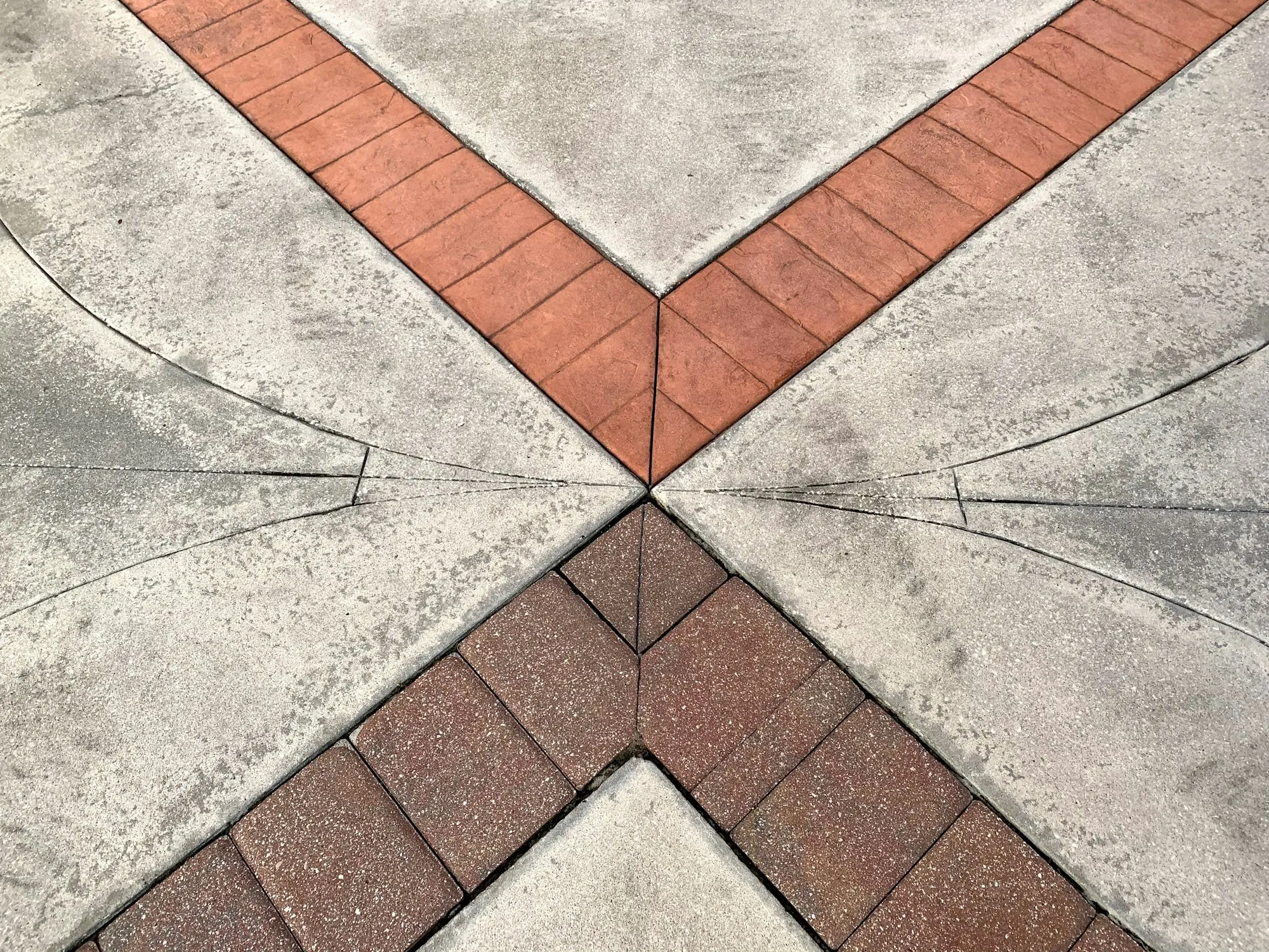 Stamped concrete with a red brick-pattern border